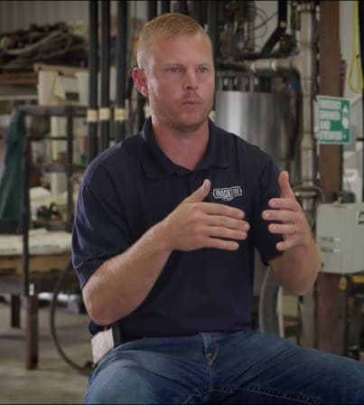 father and son in a corn field